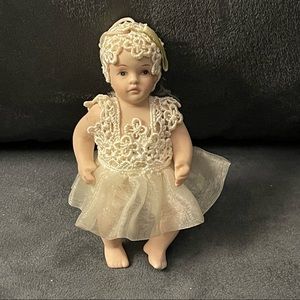Mini porcelain doll
